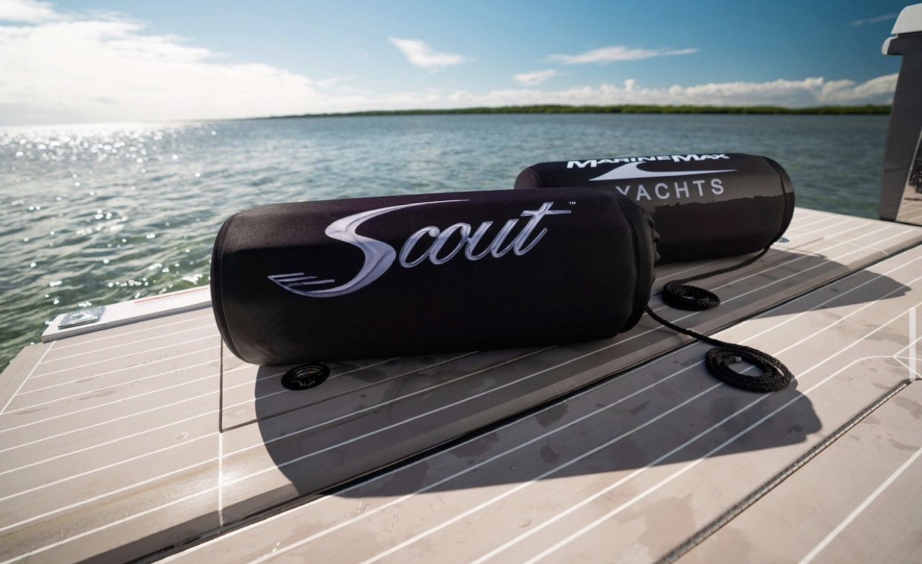 Scout and MarineMax branded FenderSox on dock