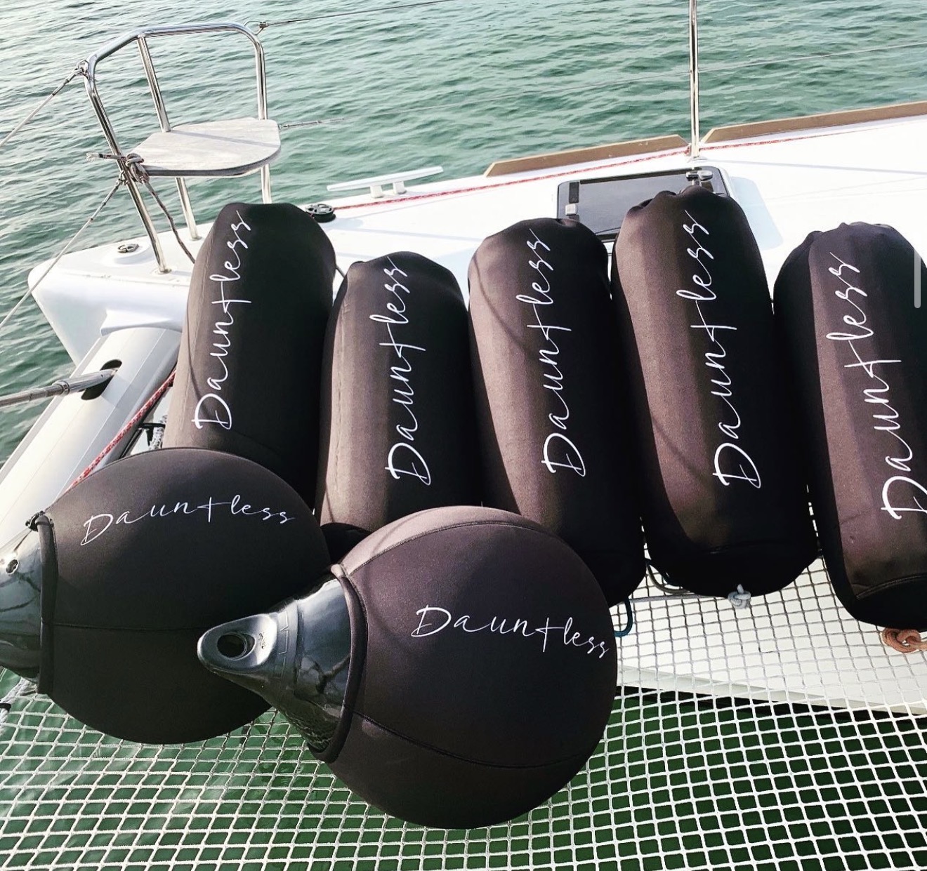 Dauntless catamaran full custom FenderSox set on dock